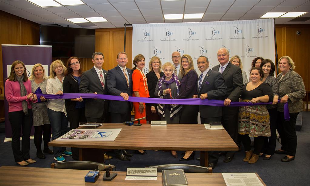 The Monmouth County Board of Chosen Freeholders, Prosecutor Christopher J. Gramiccioni, Sheriff Shaun Golden, Senator Jennifer Beck, Teri O'Connor, Monmouth County Administrator, and representatives of 180 Turning Lives Around and Impact 100 Jersey Coast join at the Family Justice Center Ribbon Cutting ceremony at the Monmouth County Courthouse.